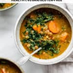 a bowl of lentil soup topped with parsley