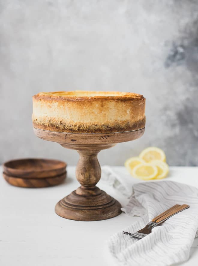 Keto cheesecake recipe - on a cake stand with lemons