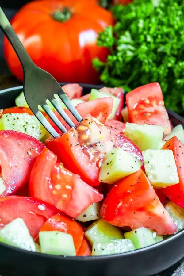 Cucumber and Tomato Salad on a fork