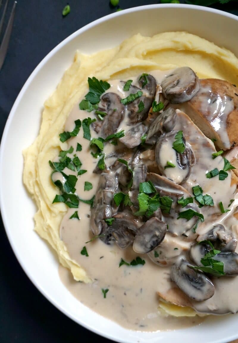 Overhead shoot of a white plate with creamy slow cooker chicken mushroom