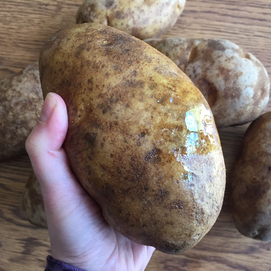 Rub potatoes with oil