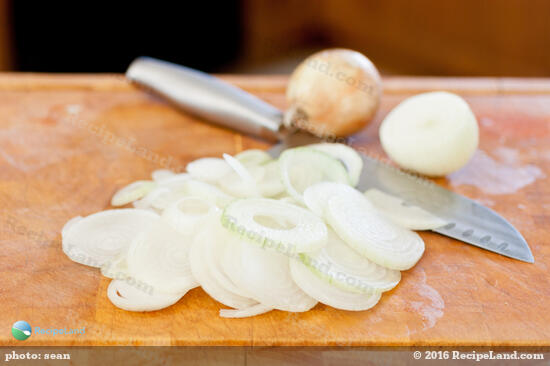 Sliced onions on a cutting board