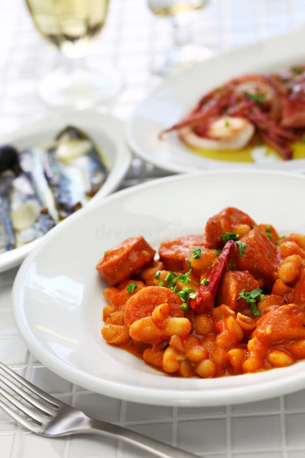 Braised with chorizo and white kidney beans, spanish tapas food stock photo