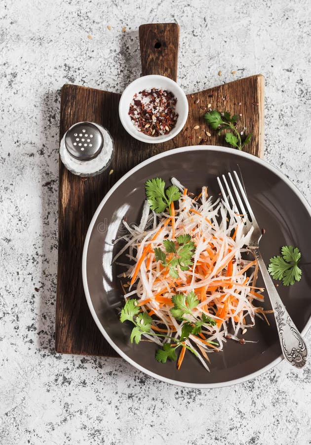 Daikon and carrot slaw. Healthy vegetarian food. royalty free stock photo