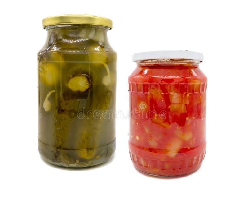 Pickled cucumbers and peppers in tomato sauce in jar royalty free stock photos