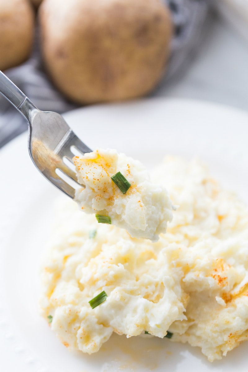 eating creamy oven baked mashed potatoes with a fork