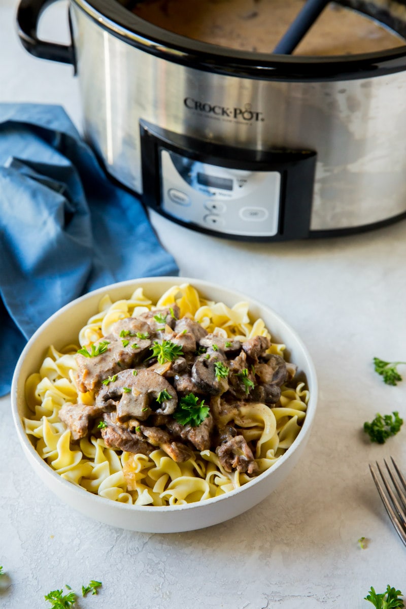 Slow Cooker Beef Stroganoff served over egg noodles