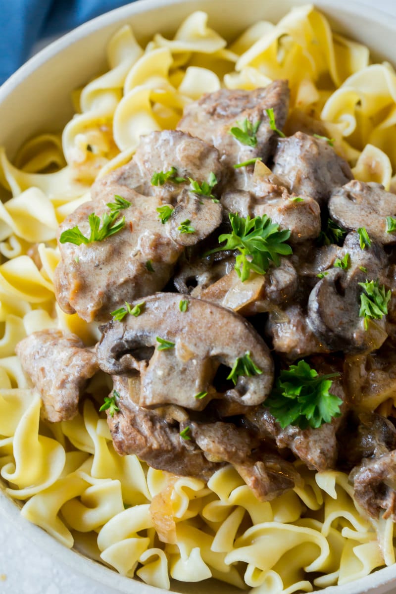 Slow Cooker Beef Stroganoff served over egg noodles