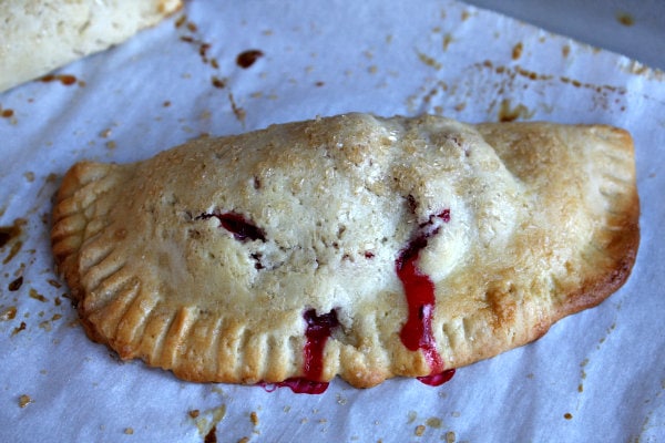 Baked Berry Hand Pie on a baking sheet lined with parchment paper