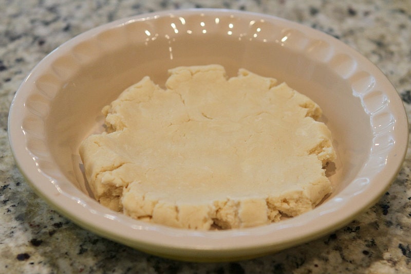 Cream Cheese Pie Crust sitting in a pie plate waiting to be pressed into the plate