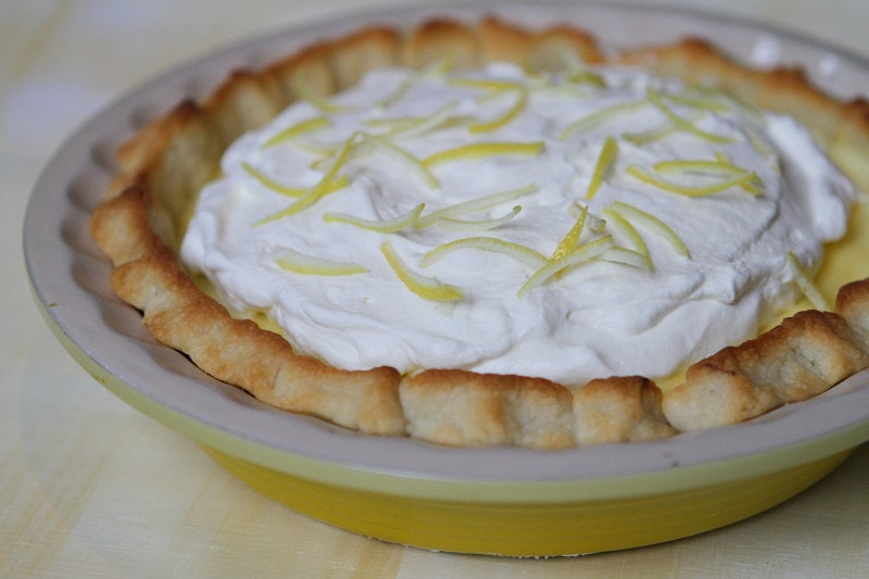 Lemon Sour Cream Pie in a yellow pie plate