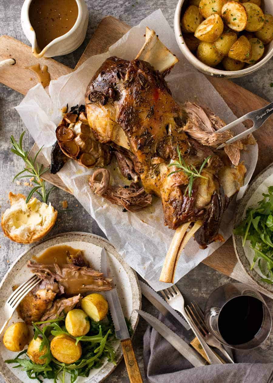 Overhead photo of Slow Cooked Lamb Shoulder dinner with lamb, roast potatoes and salad