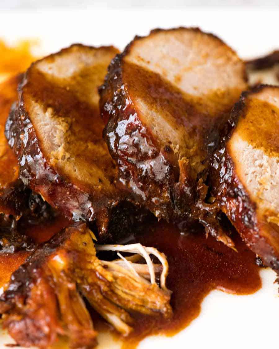 Close up of Slow Cooker Pork Loin Roast with Honey Butter sauce drizzled over it